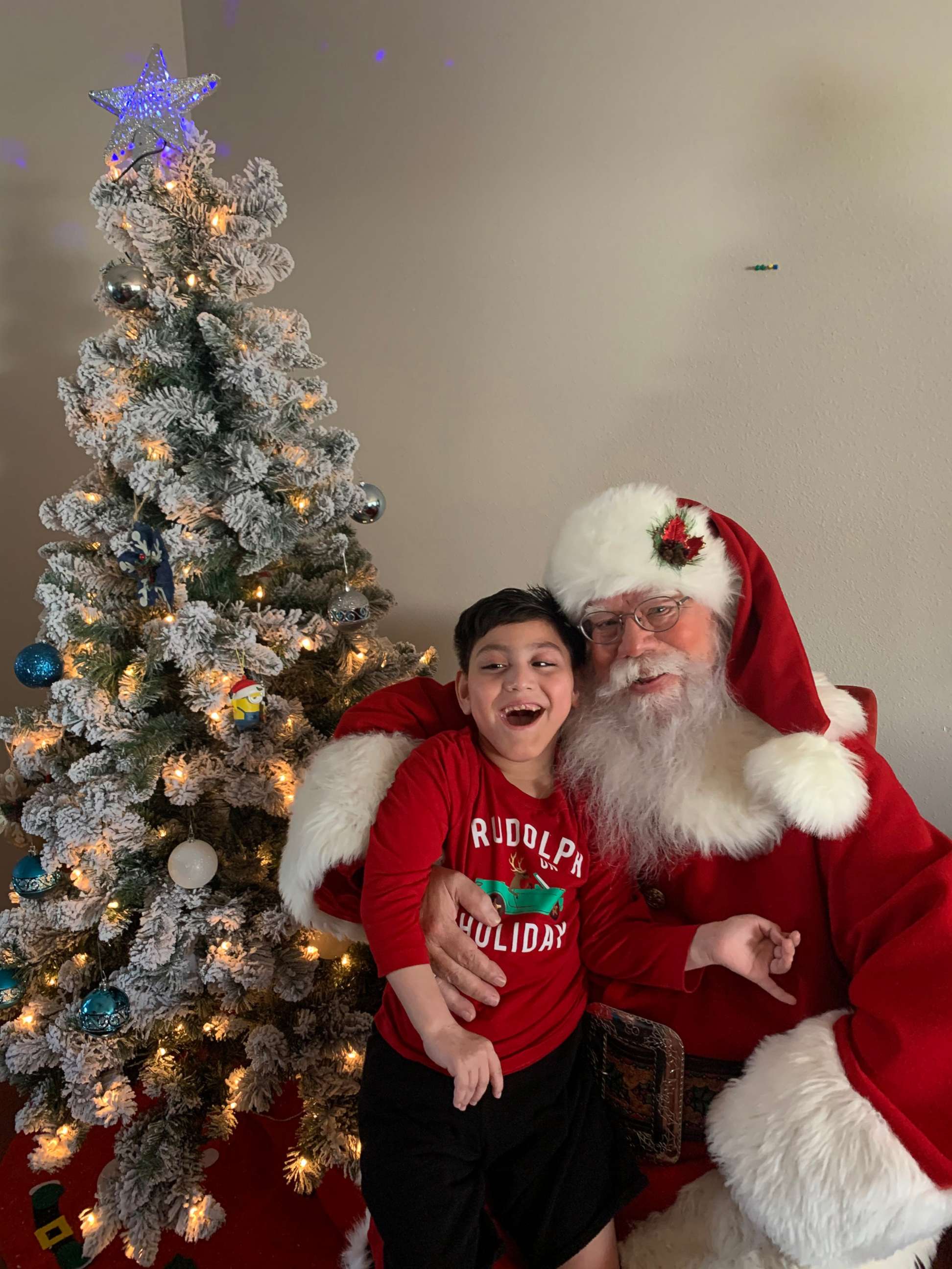 PHOTO: Cassiel Santos, 7, shared a magical moment with St. Nick and he can't hide his happiness!
