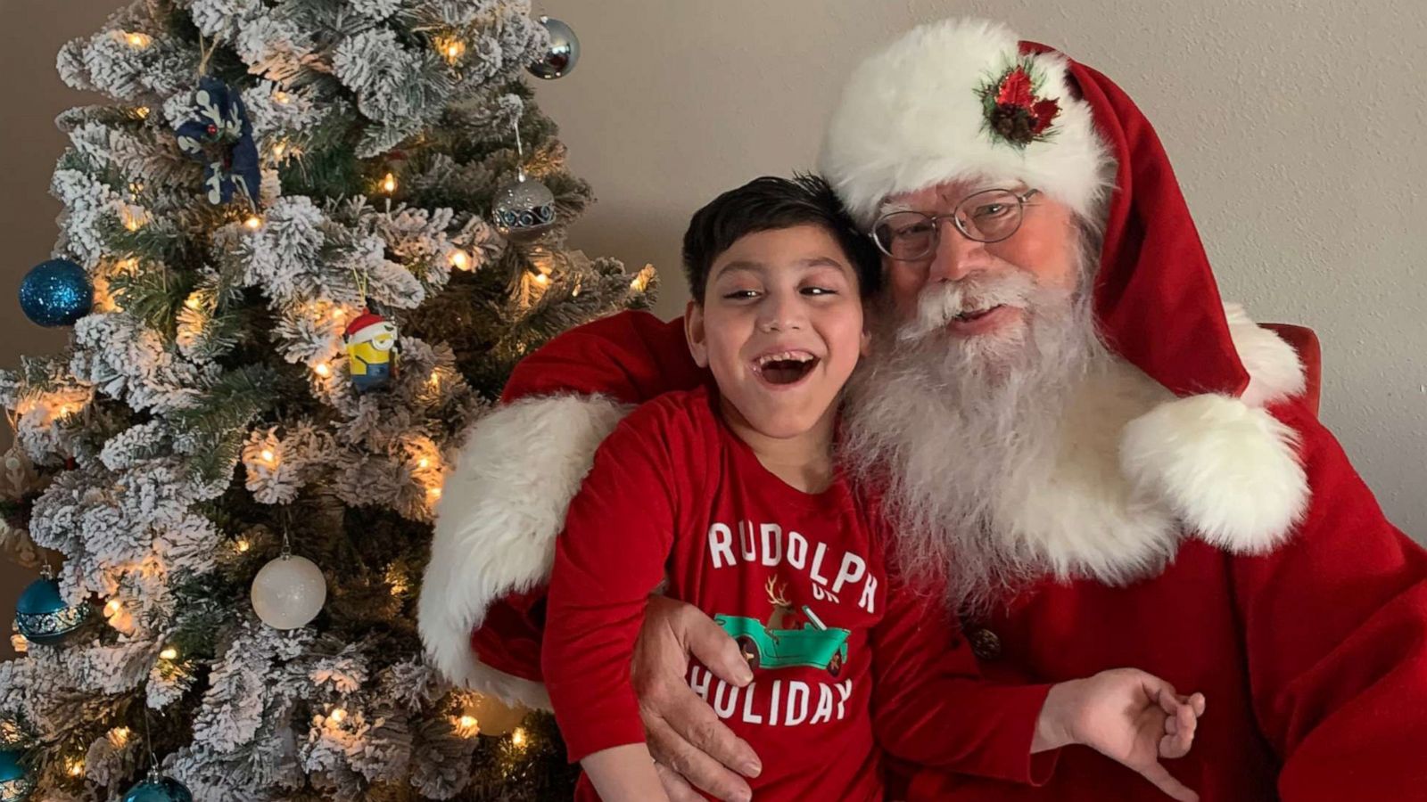 PHOTO: Cassiel Santos, 7, shared a magical moment with St. Nick and he can't hide his happiness!