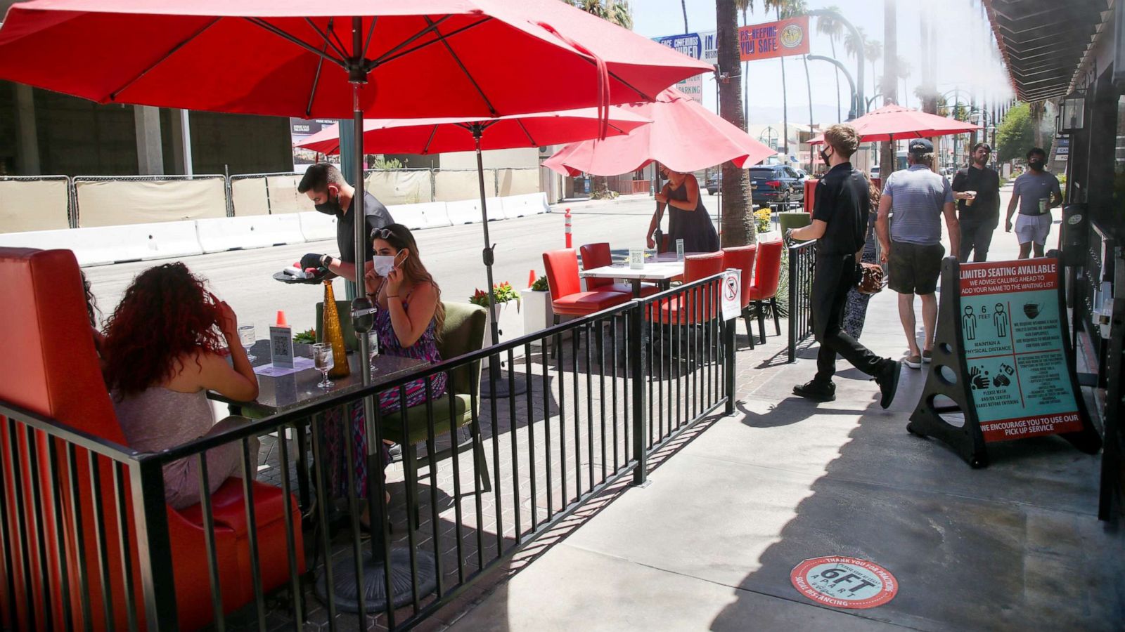 PHOTO: Customers dine in a socially distanced patio space in front of Tac/Quila restaurant in Palm Springs, Calif., Aug. 11, 2020.