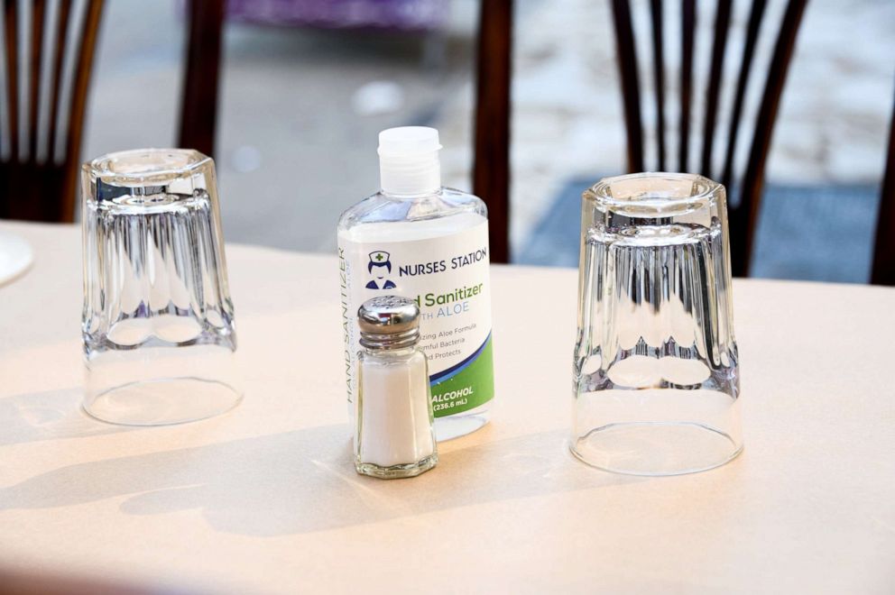 PHOTO: A hand sanitizer is placed on a dining table at a restaurant in Murray Hill, New York, Sept. 6, 2020. 