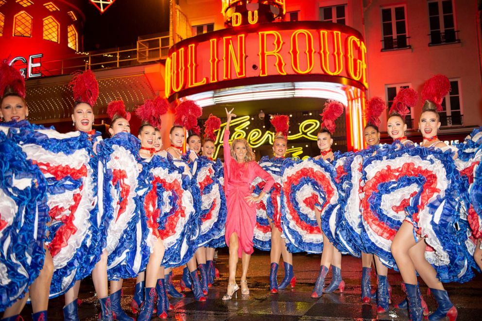 PHOTO: Celine Dion poses with dancers during her visit to "The Moulin Rouge,"  Jan. 24, 2019, in Paris. 