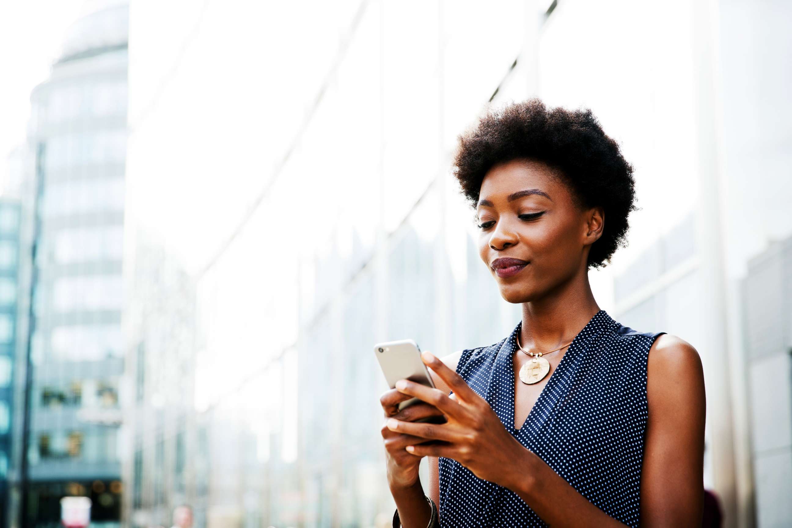 PHOTO: A woman uses a cellphone in this stock photo.