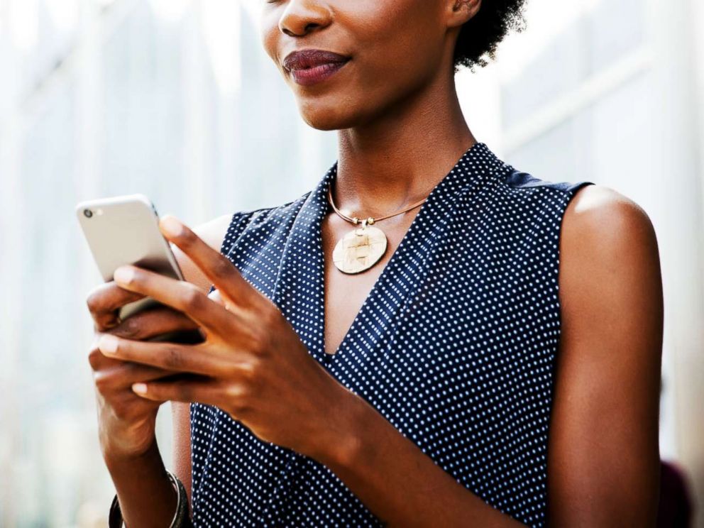 PHOTO: A woman uses a cellphone in this stock photo.