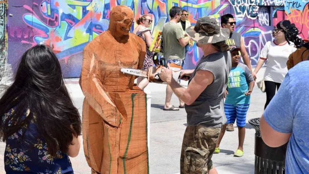 PHOTO: Stacy Poitras live carving at Venice Beach, Calif., July, 2019.