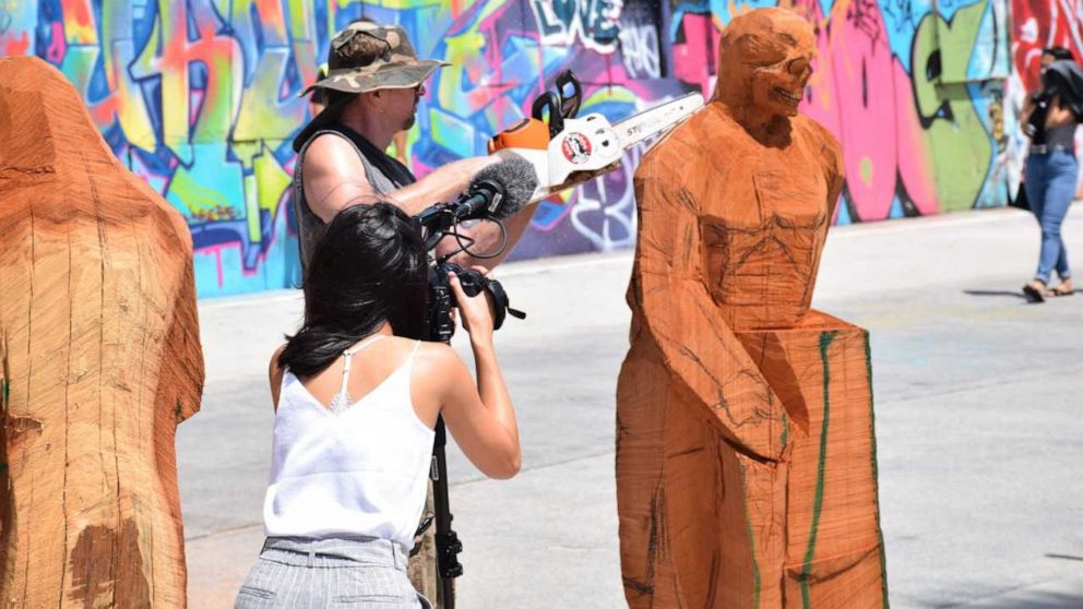 PHOTO: Stacy Poitras live carving at Venice Beach, Calif., July, 2019.