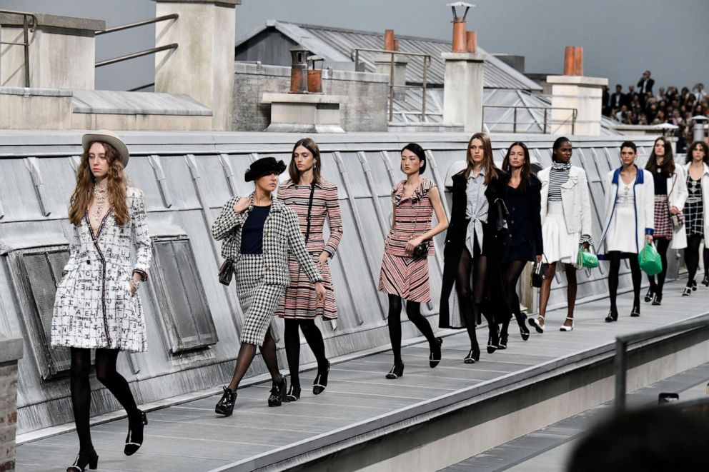 PHOTO: A spectator inserting herself among the lineup of models during the finale, identified as Marie Benoliele, during the Chanel Ready to Wear Spring/Summer 2020 fashion show as part of Paris Fashion Week on October 01, 2019, in Paris.