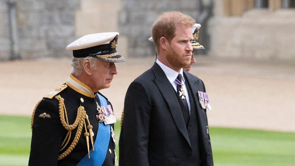 PHOTO: Britain's King Charles III walks with his son Britain's Prince Harry, Duke of Sussex as they arrive at St George's Chapel inside Windsor Castle on September 19, 2022.
