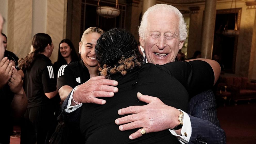 PHOTO: King Charles III smiles as he meets New Zealand's Black Ferns rugby union team at Buckingham Palace in London, Sept. 11, 2024.