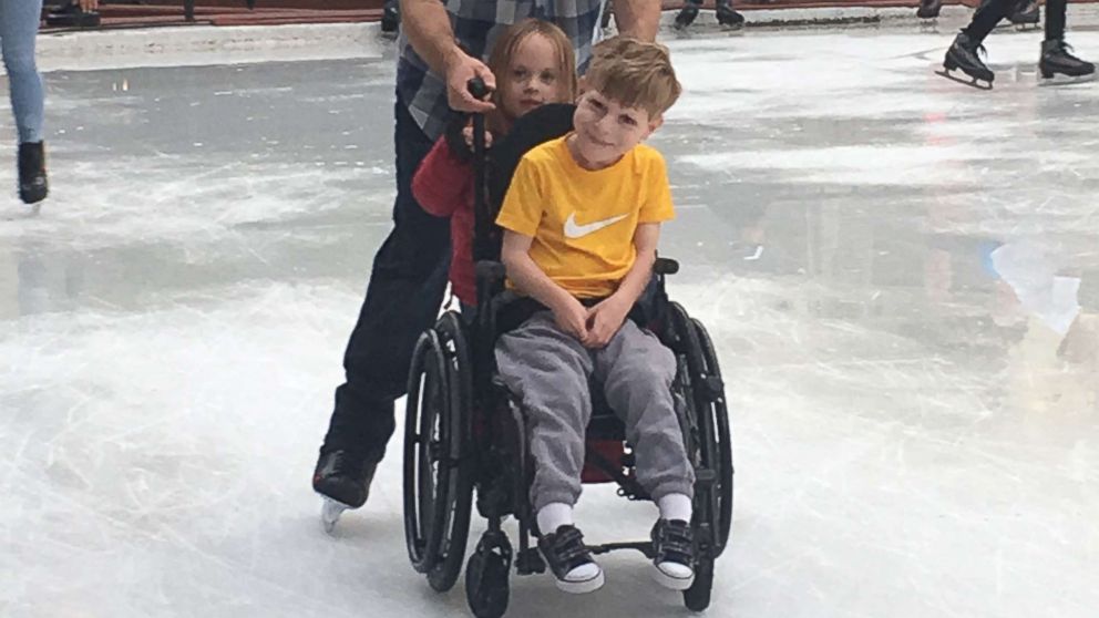 PHOTO: Jody Sumner pushes his son Charlie across the Beaver Creek Ice Rink in Beaver Creek, Colo.