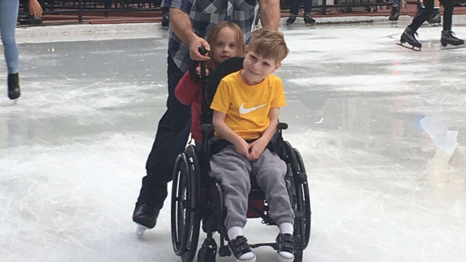 PHOTO: Jody Sumner pushes his son Charlie across the Beaver Creek Ice Rink in Beaver Creek, Colo.