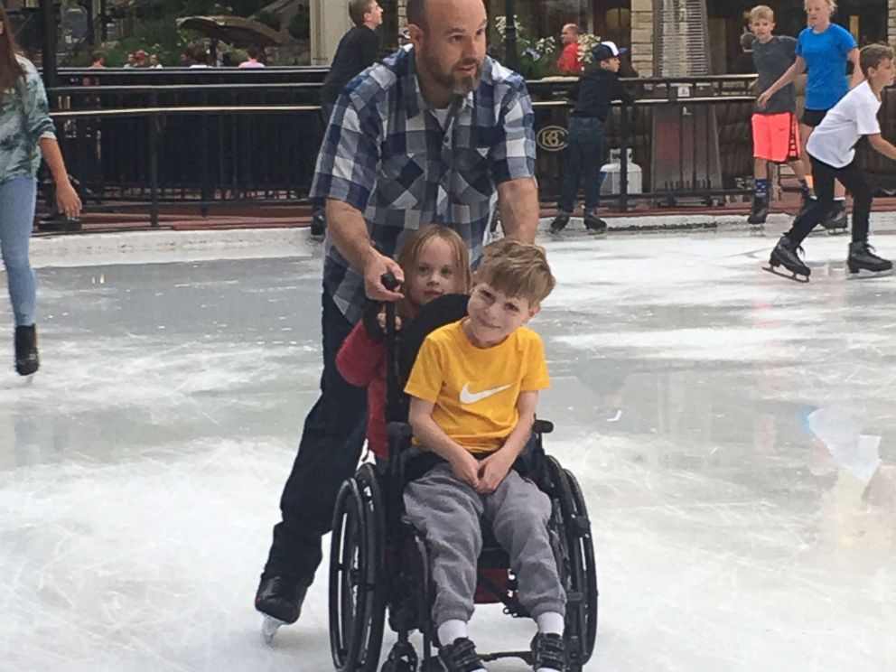 PHOTO: Jody Sumner pushes his son Charlie across the Beaver Creek Ice Rink in Beaver Creek, Colo.