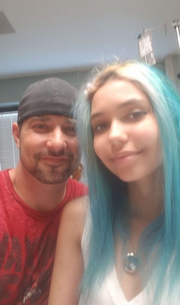 PHOTO: Charlie and his daughter Paige Winter take a photo in the hospital while she recovered from a shark attack. 