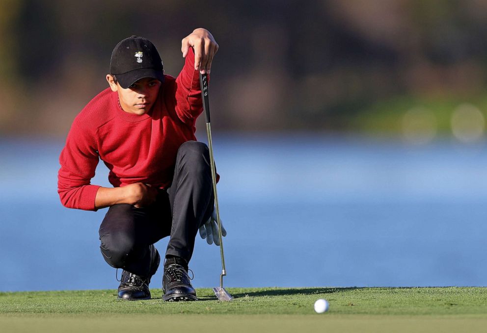 PHOTO: Charlie Woods lines up a putt, Dec. 18, 2022, on the 18th hole during the final round of the PNC Championship at Ritz-Carlton Golf Club in Orlando, Fla.