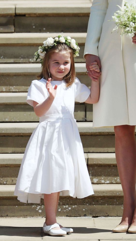 PHOTO: Princess Charlotte of Cambridge (L) waves holding the hand of her mother Britain's Catherine, Duchess of Cambridge, (R) after attending the wedding ceremony of Prince Harry and Meghan Markle at Windsor Castle, in Windsor, May 19, 2018.