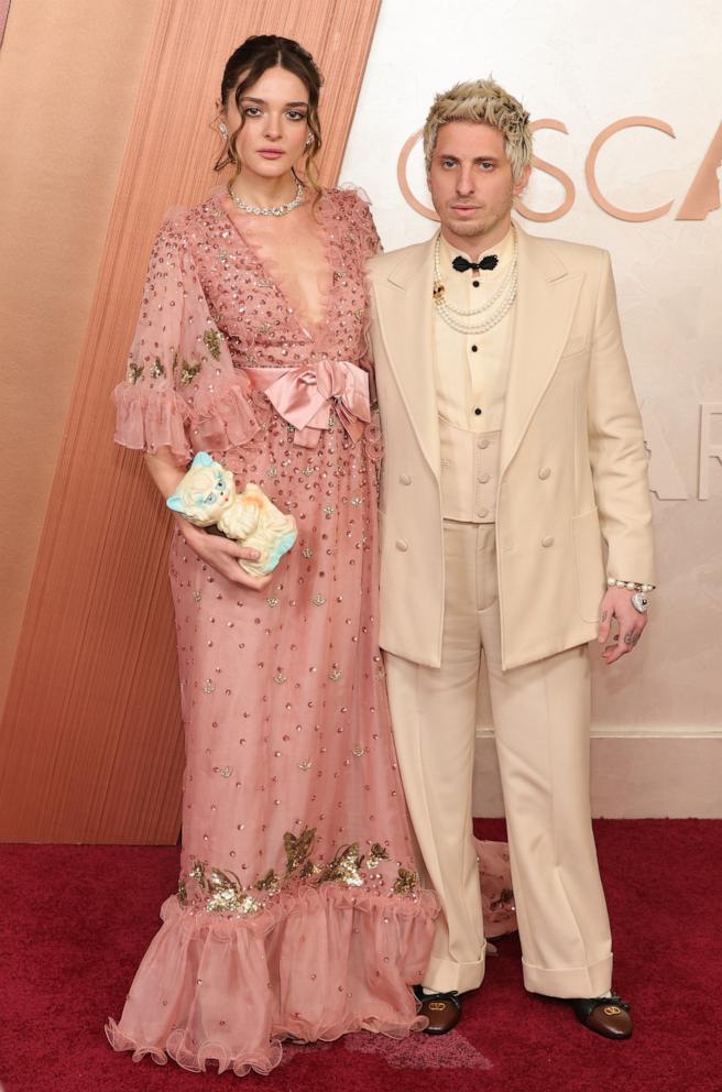 PHOTO: Charlotte Lawrence and Andrew Watt attend the 97th Annual Oscars on March 02, 2025 in Hollywood, Calif.