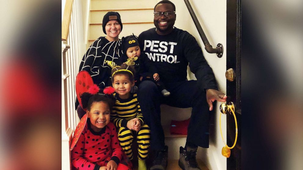 PHOTO: Charlotte Ngarukiye poses for a photo with her husband and their three children in October 2019.