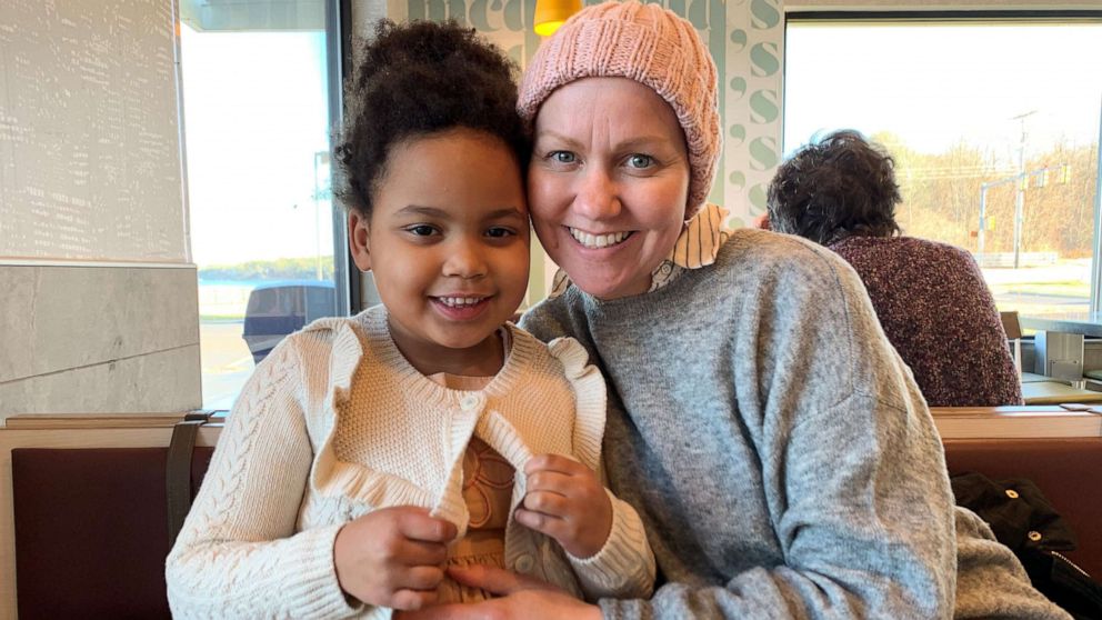 PHOTO: Charlotte Ngarukiye, of New Hampshire, poses with her daughter while undergoing treatment for colorectal cancer.