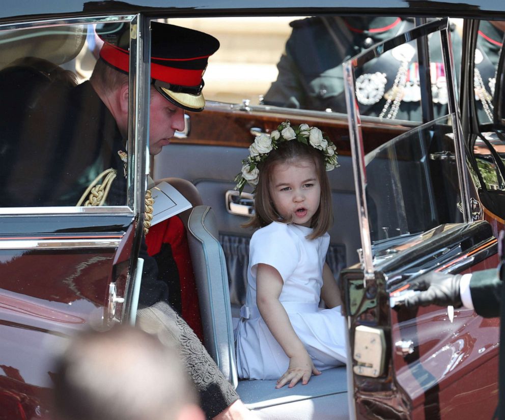 PHOTO: Prince William, Duke of Cambridge and his daughter Princess Charlotte leave after attending the wedding ceremony of Prince Harry, Duke of Sussex and  Meghan Markle at St George's Chapel in Windsor Castle, in Windsor, England, May 19, 2018.