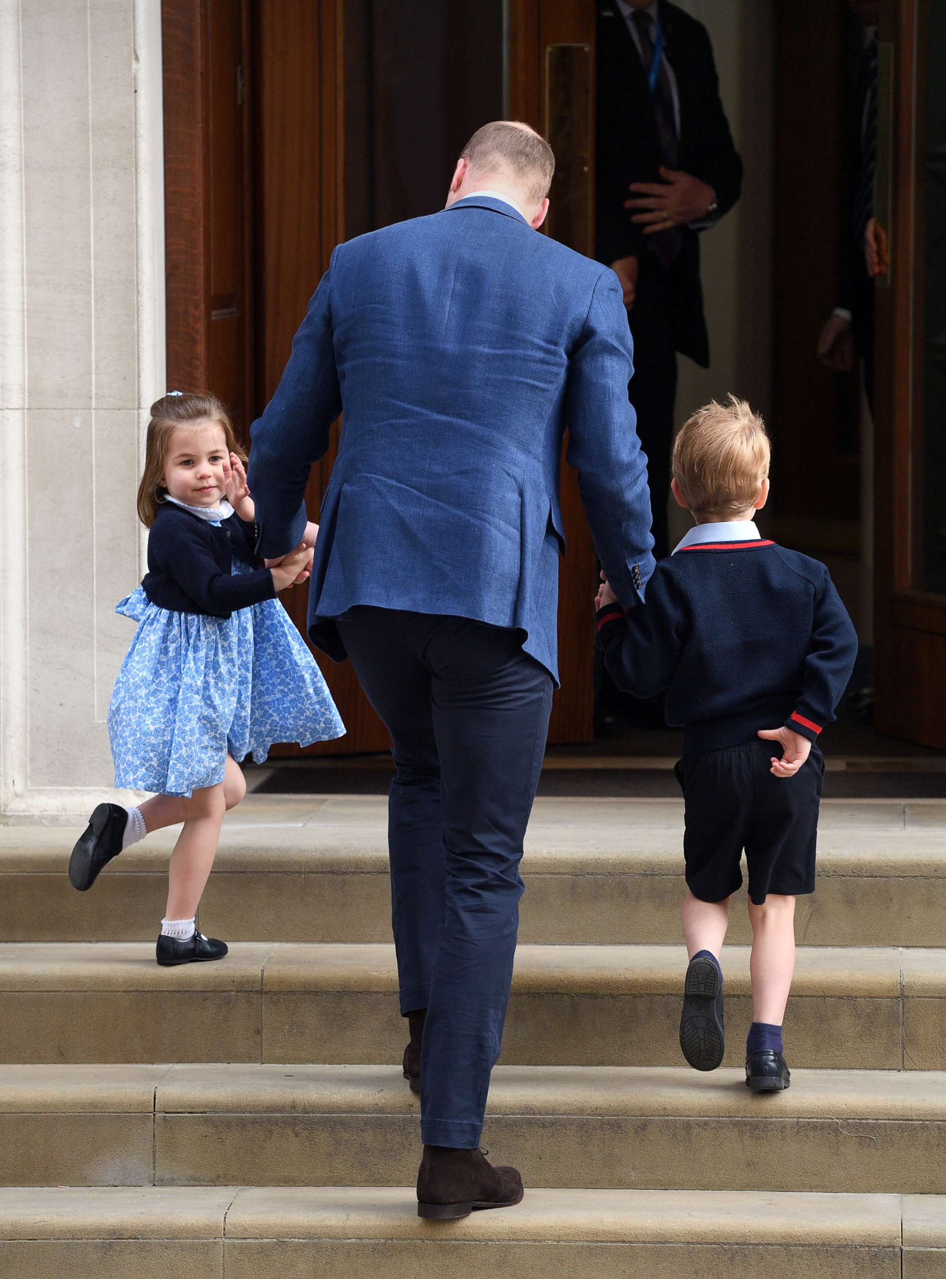 PHOTO: Princess Charlotte waves to the press as she arrives with her father, Prince William, Duke of Cambridge and Prince George to the Lindo Wing of St. Mary's Hospital to meet her new baby brother, Louis, April 23, 2018 in London.