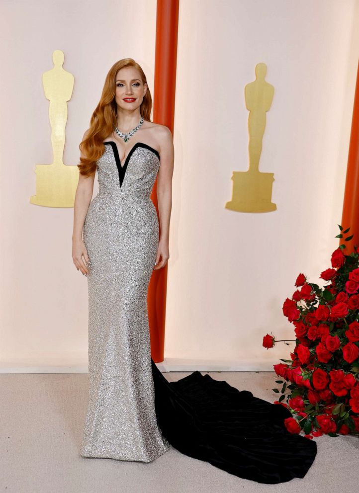 PHOTO: Jessica Chastain poses on the champagne-colored red carpet during the Oscars arrivals at the 95th Academy Awards in Hollywood, Calif., March 12, 2023.
