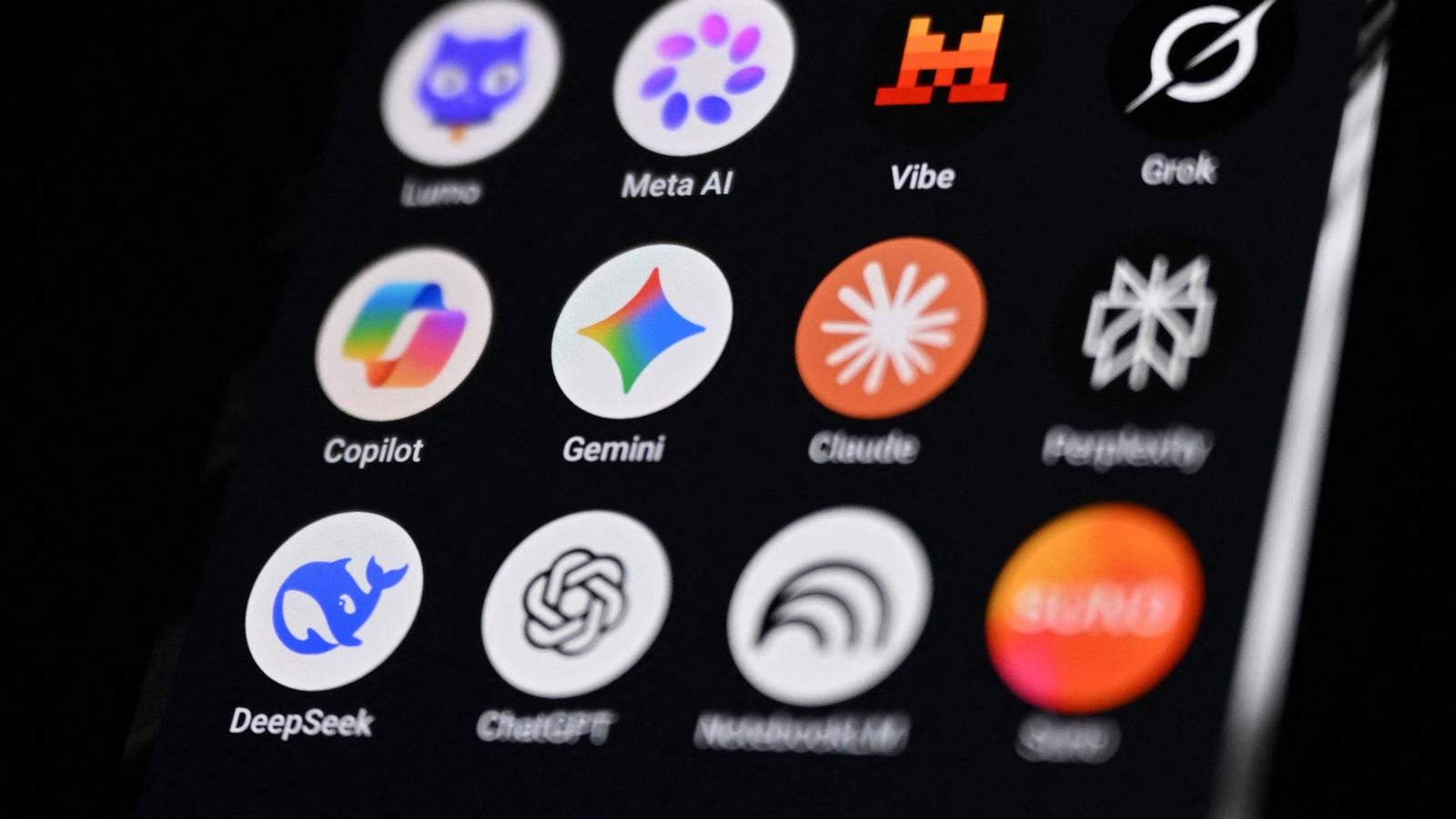 PHOTO: This photograph shows a handheld smartphone displaying the icons of some of the main artificial intelligence based apps.