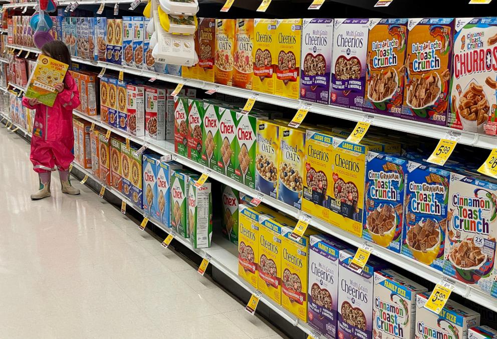 PHOTO: Boxes of General Mills cereal are displayed on a grocery store shelf on Dec. 20, 2023 in San Anselmo, Calif.