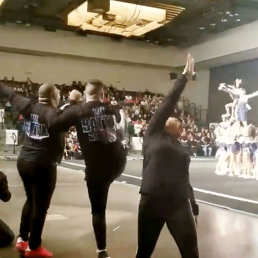 PHOTO: Coaches Trey McGhee and Kymberli Browder of All-Star Revolution gym in Texas, were captured cheering on their cheerleading team on Jan. 12. 