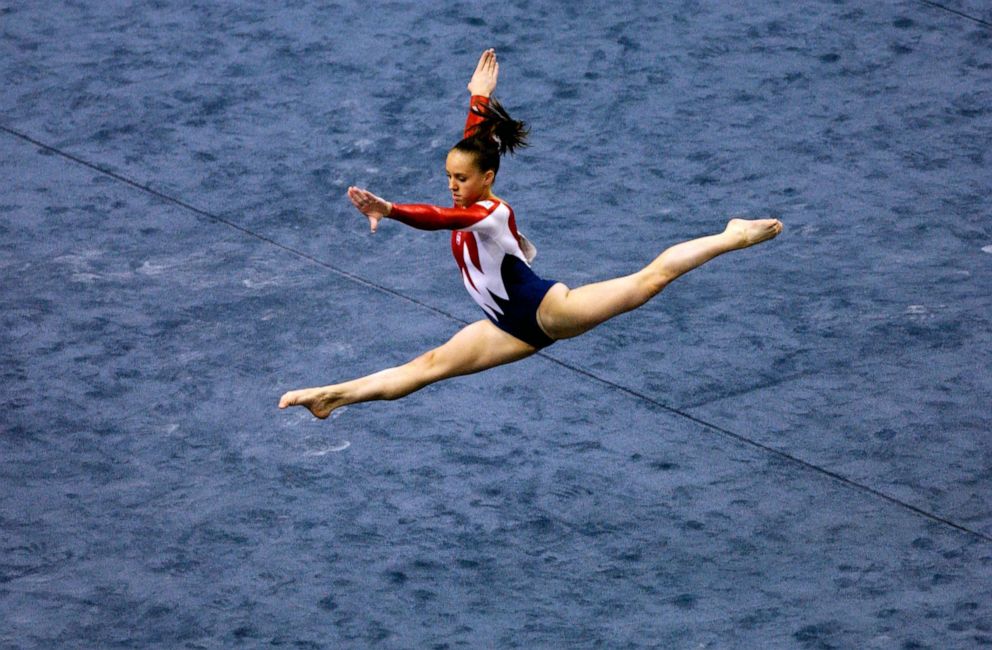 PHOTO: In this Aug. 20, 2003, file photo, Chellsie Memmel leaps during the floor event of the women's team final at the 2003 Gymnastics World Championships, in Anaheim, Calif. 