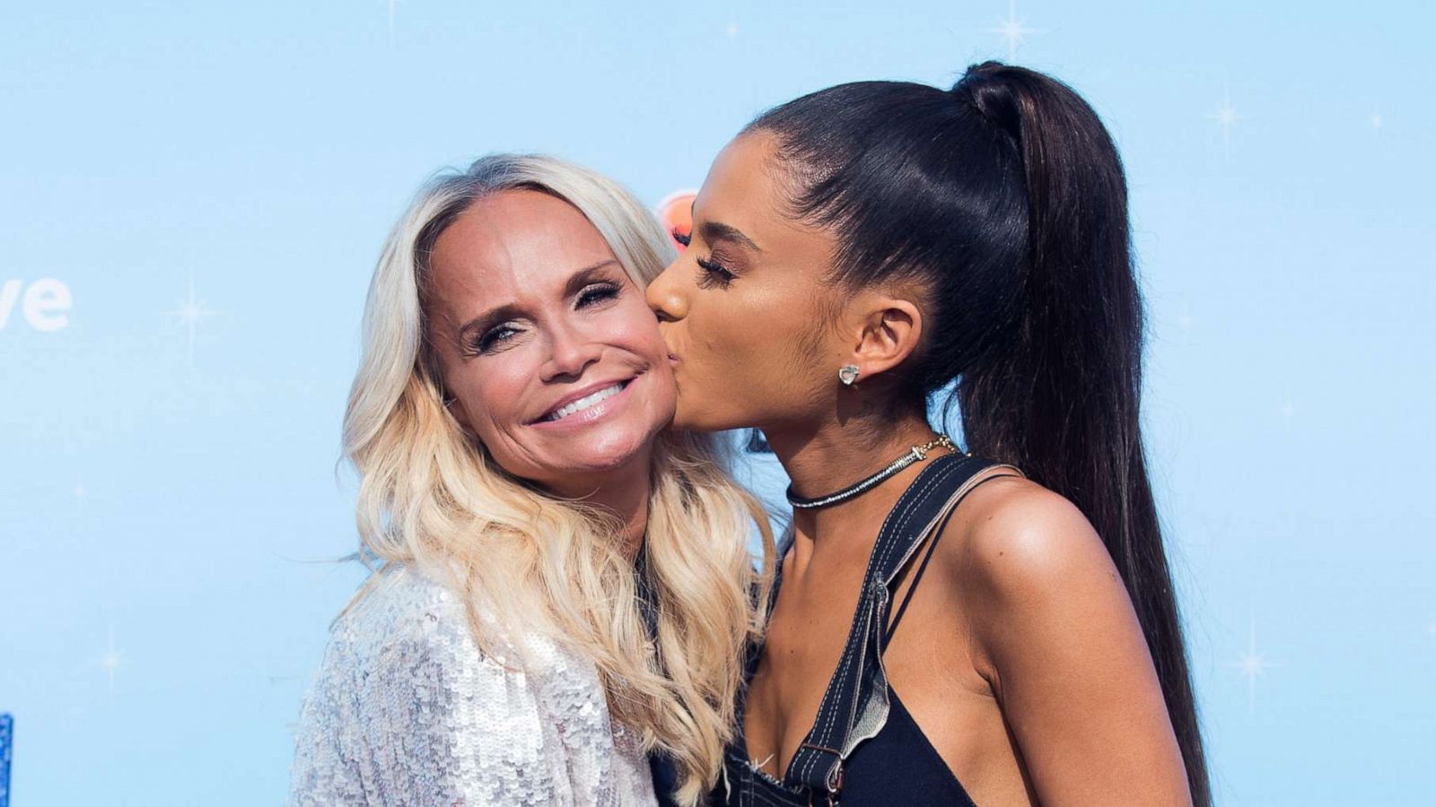 PHOTO: Actress Kristin Chenoweth gets a kiss from singer Ariana Grande, right, at an event on Nov. 16, 2016, in Universal City, Calif.