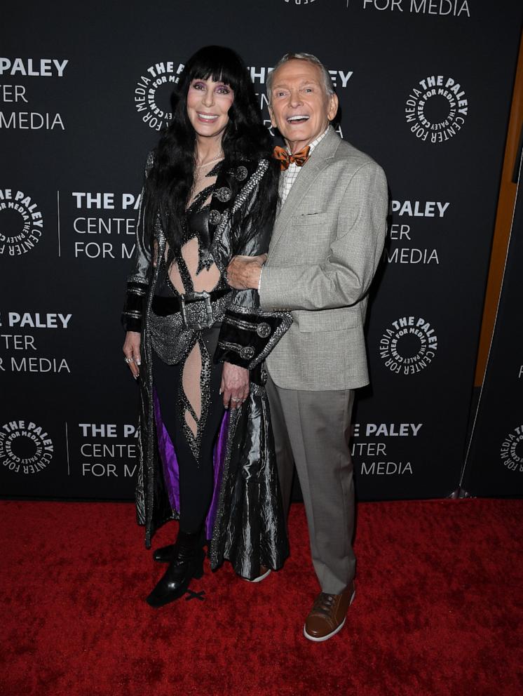 PHOTO: Cher, Bob Mackie arrive at the "Bob Mackie: Naked Illusion": A Legendary Evening With Bob Mackie, Carole Burnett, RuPaul Charles, Cher & Friends at Directors Guild Of America on May 13, 2024 in Los Angeles.