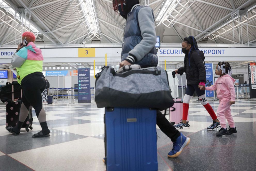 PHOTO: Travelers arrive for flights at O'Hare international Airport on March 16, 2021, in Chicago.
