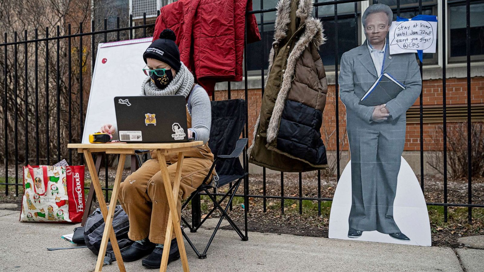 PHOTO: A teacher sets up her laptop outside of Suder Montessori Magnet Elementary School to begin virtual classes in solidarity with pre-K educators forced back into the building in Chicago, Jan. 11, 2021.