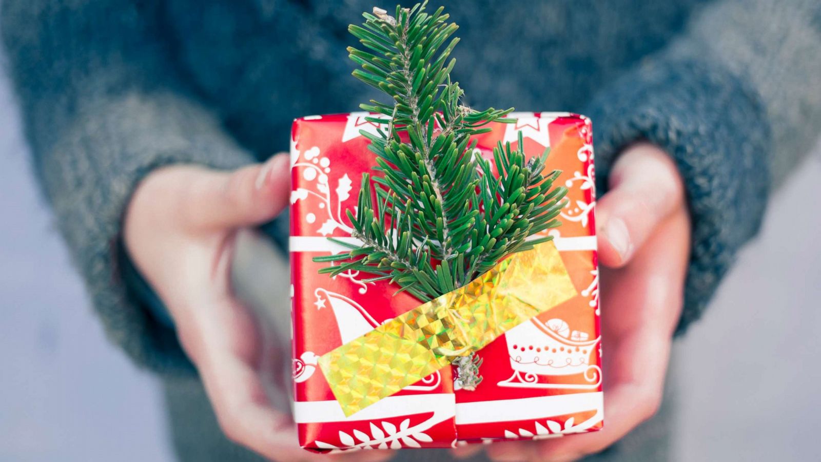 PHOTO: Child giving a Christmas gift.