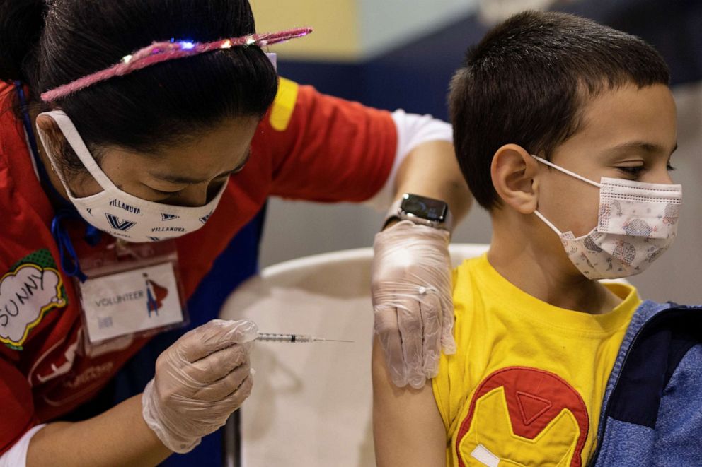 PHOTO: Jace Quinones, 7, receives the Pfizer-BioNTech coronavirus disease vaccine in Lansdale, Pa., Dec. 5, 2021.