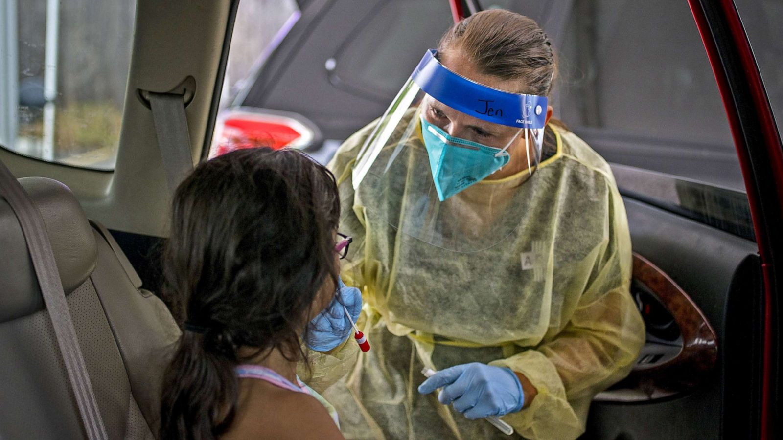 PHOTO: A healthcare worker administers a Covid-19 test to a child at a drive-thru vaccination and testing site in Austin, Texas, Aug. 5, 2021.