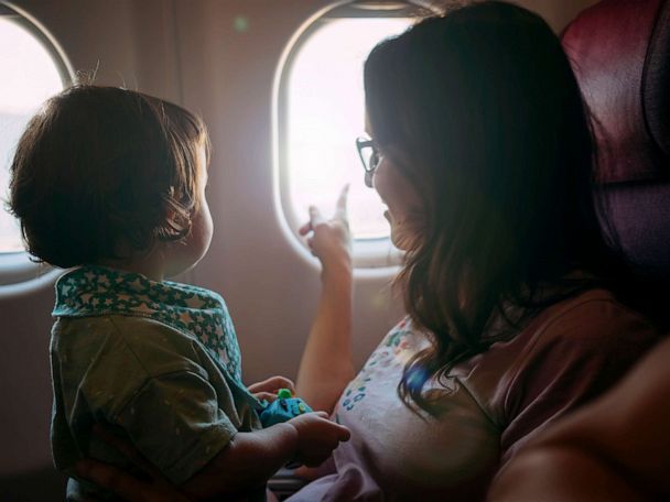 Child in 2024 lap airplane