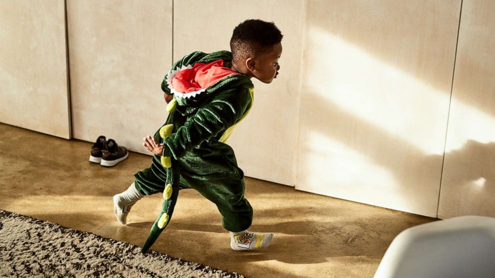 PHOTO: Boy playing in a dragon outfit.