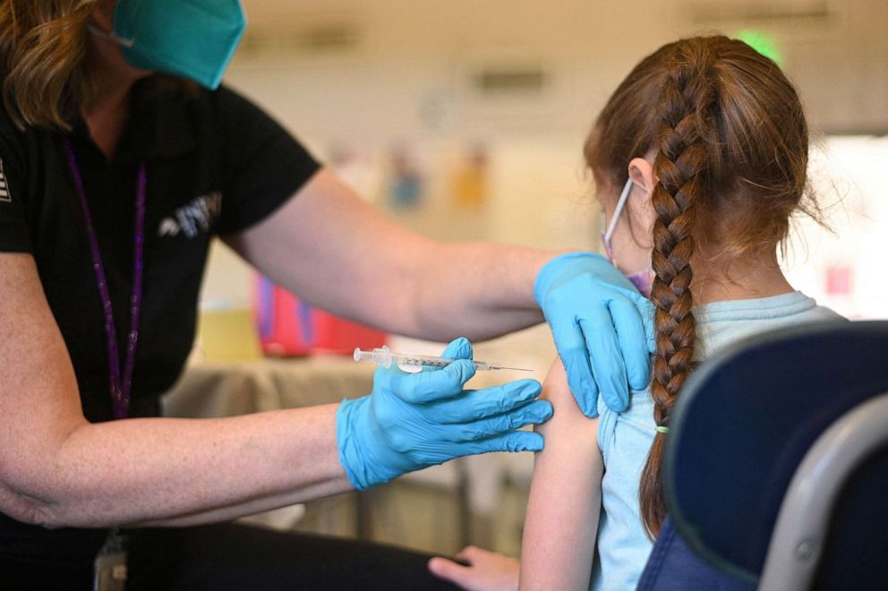PHOTO: A nurse administers a pediatric dose of the Covid-19 vaccine to a child at a L.A. Care Health Plan vaccination clinic at Los Angeles Mission College in the Sylmar neighborhood in Los Angeles, Jan. 19, 2022.