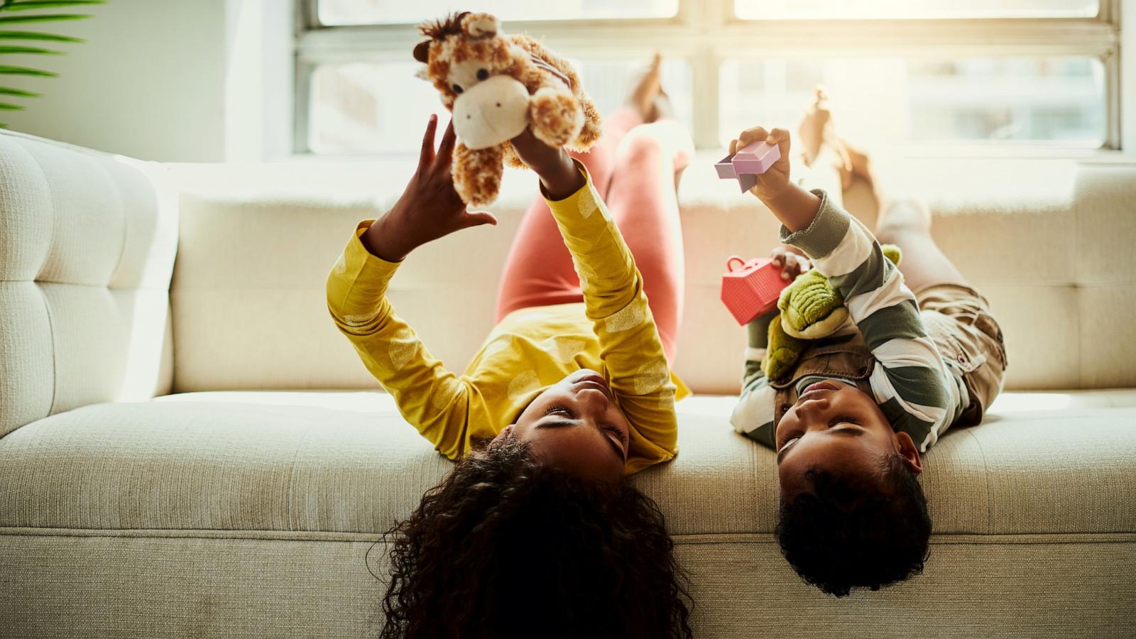 PHOTO: Stock photo of children laying on a couch.