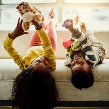 PHOTO: Stock photo of children laying on a couch.