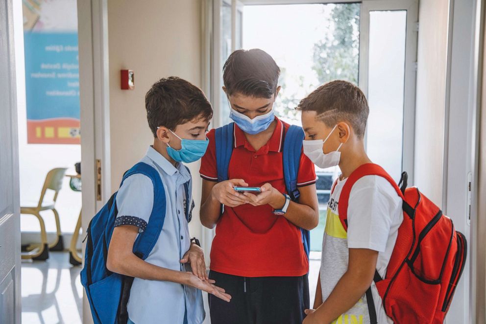 PHOTO: In this undated file photo, three boys play games on a smart phone at school.