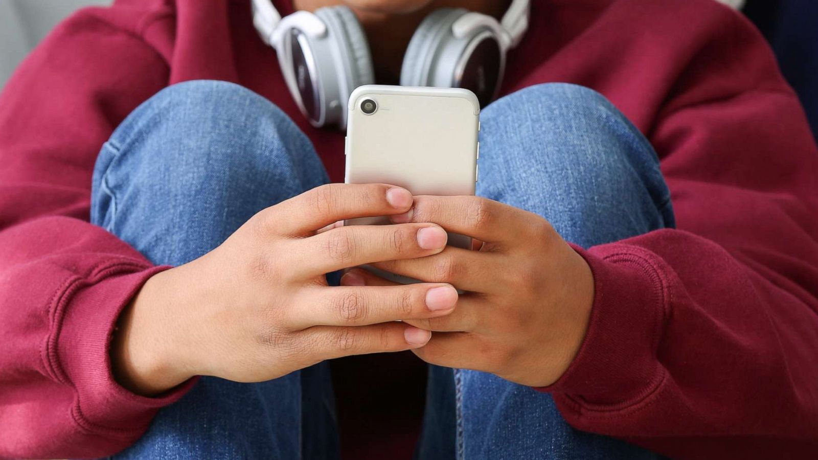 PHOTO: A teenage boy uses a mobile phone in a stock image.