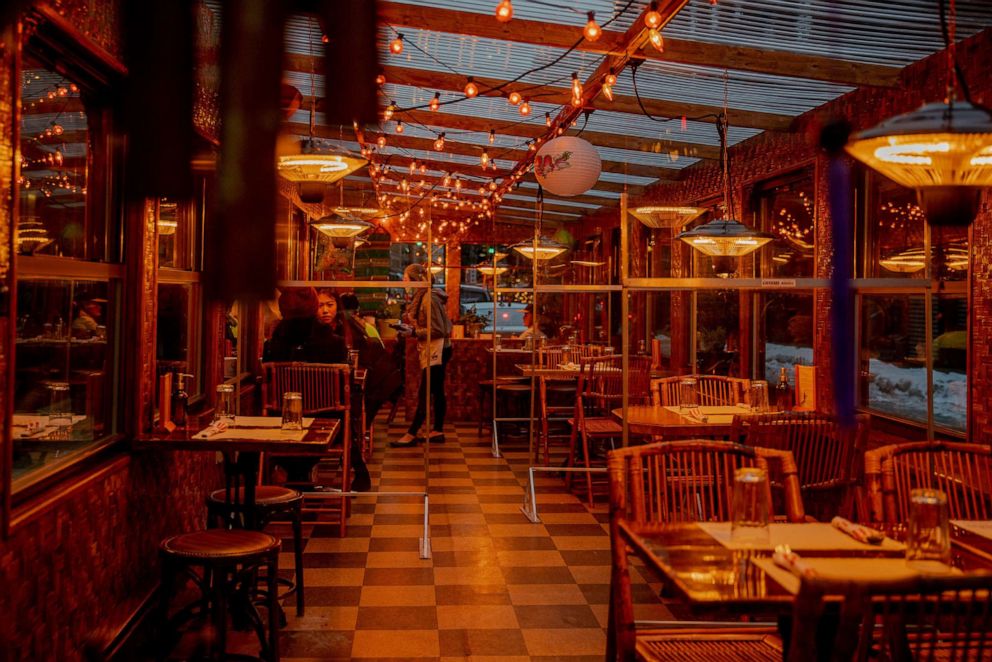 PHOTO: People eat in the outdoor section of a restaurant in the Chinatown neighborhood of New York, on Feb. 12, 2021.