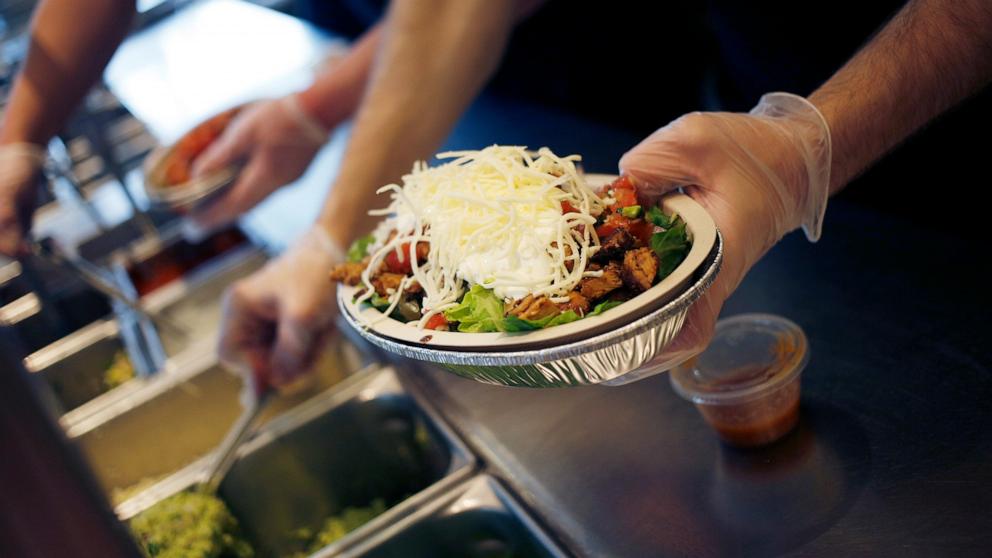 PHOTO: In this Feb. 2, 2019, file photo, an employee prepares a burrito bowl at a Chipotle Mexican Grill Inc. restaurant in Louisville, Kentucky.