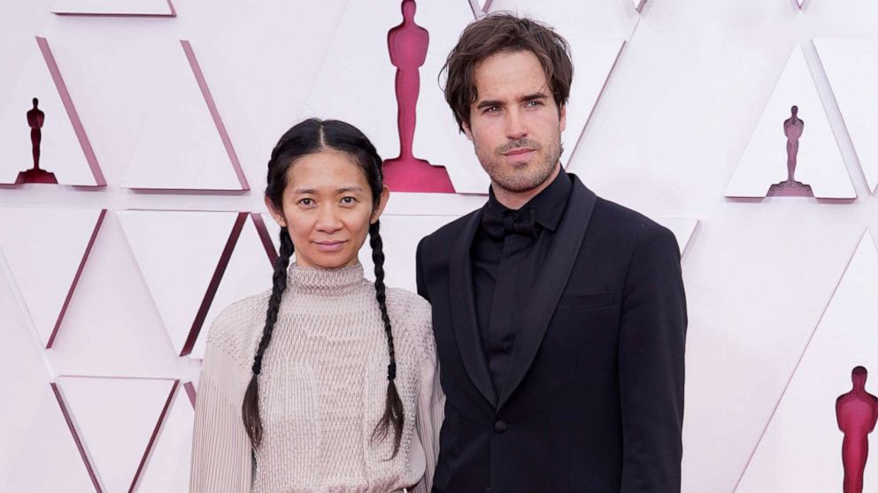 PHOTO: Chloe Zhao and Joshua James Richards arrive to the 93rd Academy Awards, at Union Station, in Los Angeles, April 25, 2021.