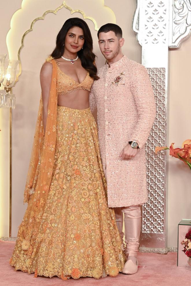 PHOTO: Priyanka Chopra Jonas and actor Nick Jonas pose as they arrive to attend the wedding ceremony of billionaire tycoon and Chairman of Reliance Industries Mukesh Ambani's son Anant Ambani and Radhika Merchant in Mumbai on July 12, 2024.