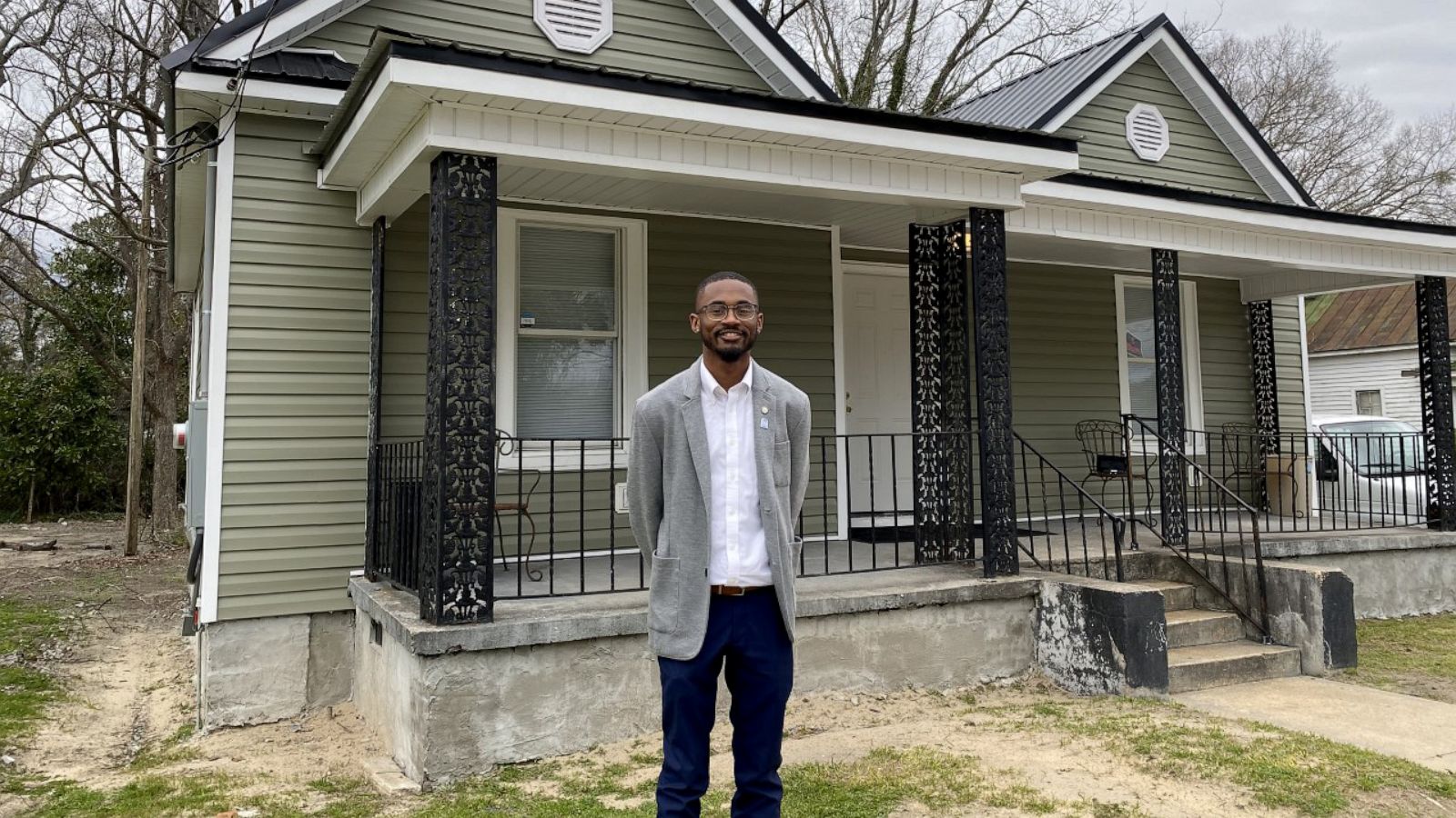 PHOTO: Chris Suggs, 19, stands in front of his newly-renovated property, Kinston Teens Neighborhood Hub.