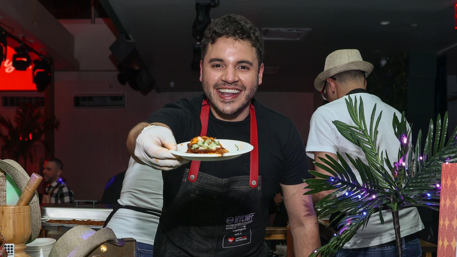 PHOTO: Chef Chris Valdes serves his Ropa Vieja Birria Tacos at Latin Nights as part of the Food Network New York City Wine & Food Festival presented by Capital One, Oct. 14, 2023, in New York.