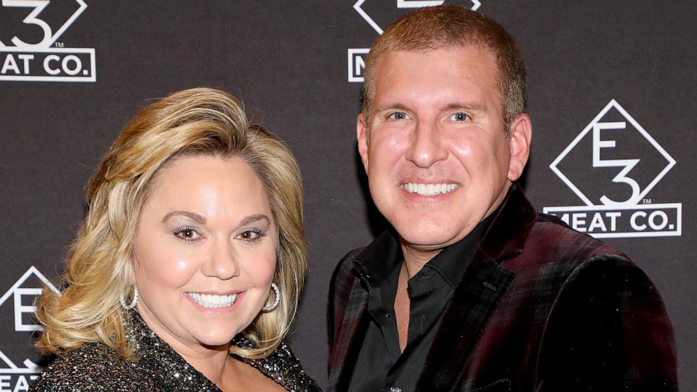 PHOTO: Julie Chrisley and Todd Chrisley attend the grand opening of E3 Chophouse Nashville on November 20, 2019 in Nashville, Tennessee.