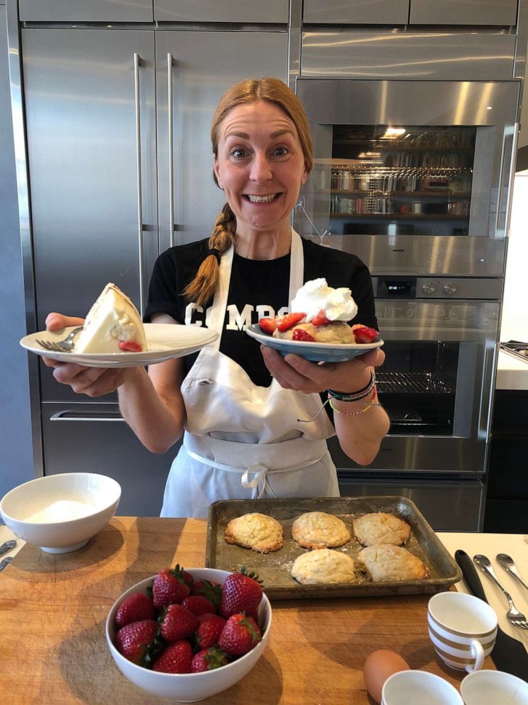PHOTO: Pastry chef and Milk Bar founder holds up a slice of strawberry cake and her homemade strawberry shortcakes.